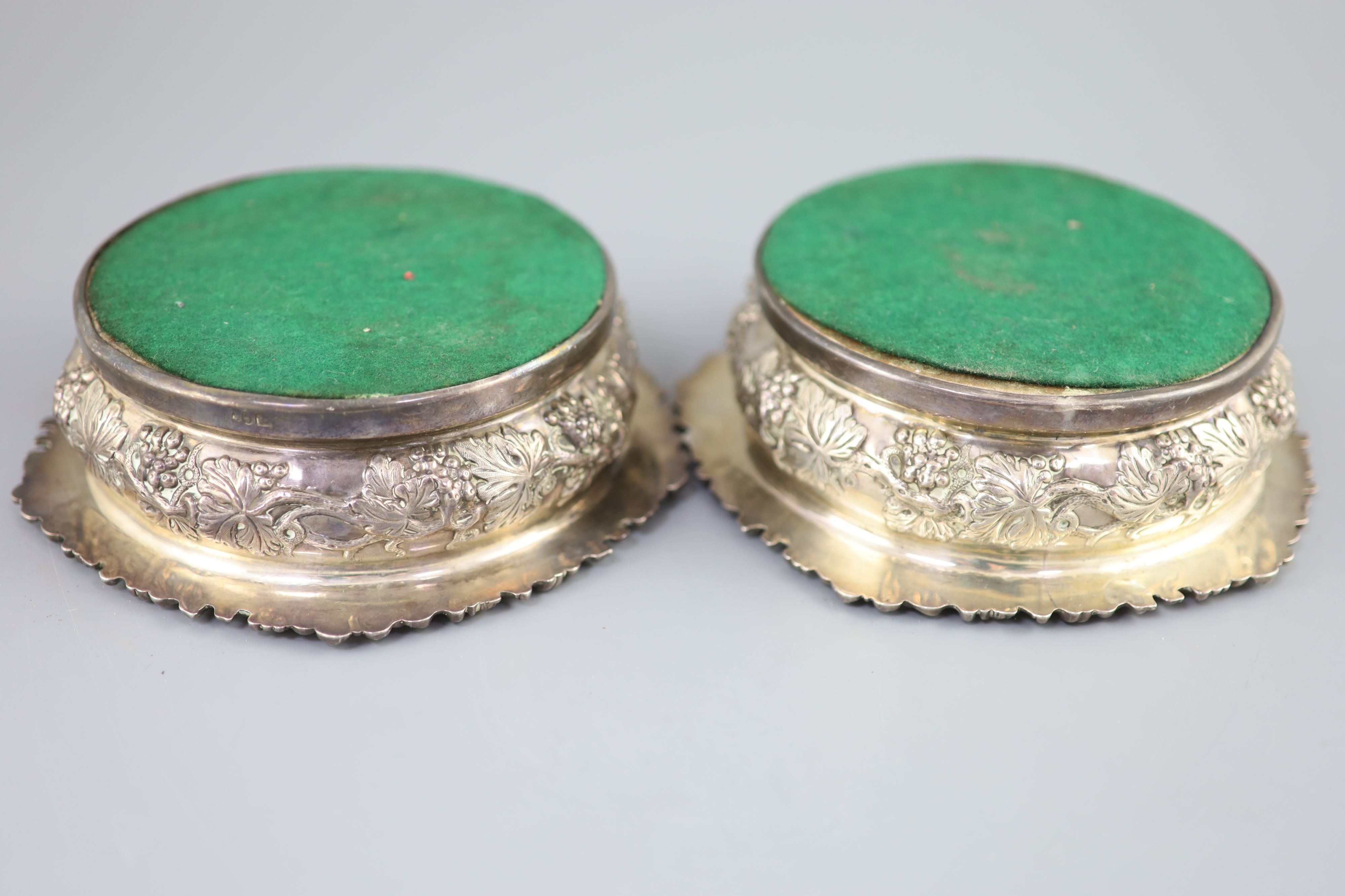 A pair of George IV silver wine coasters, S.C. Younge & Co, Sheffield, 1824, 16.7cm,